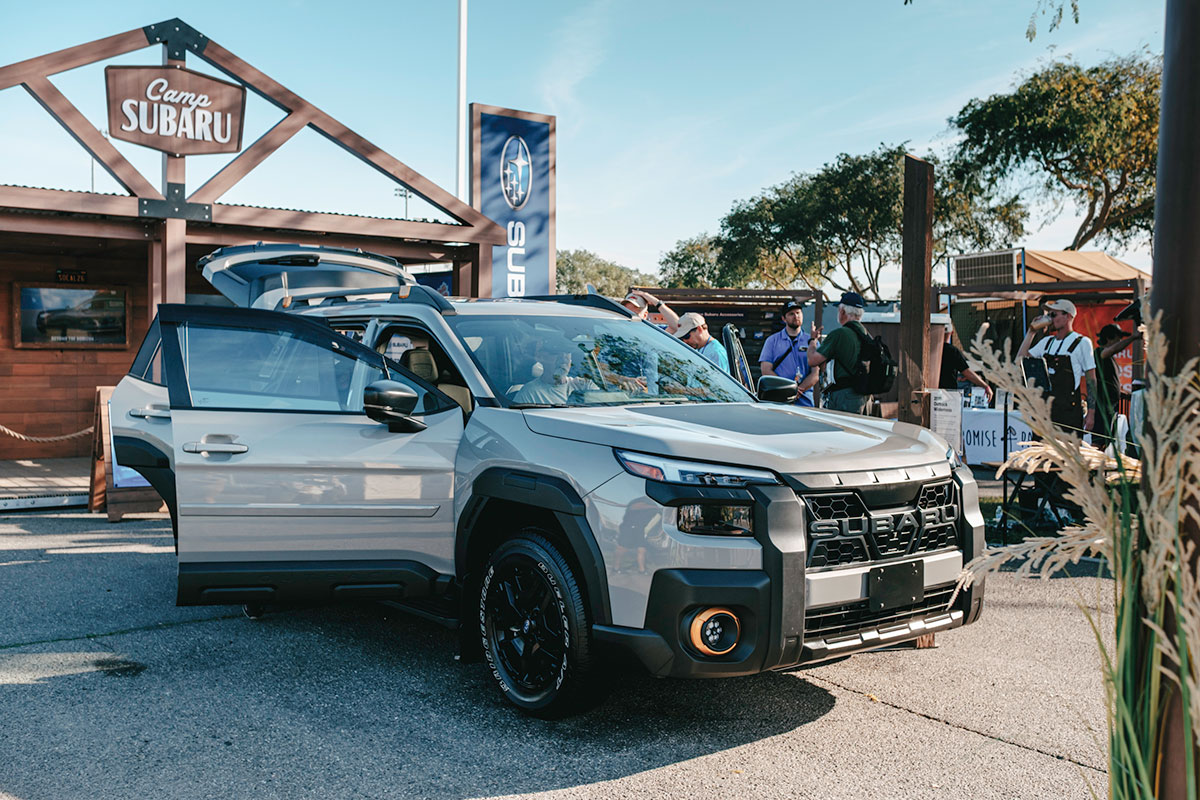 Camp Subaru Wilderness vehicle display with guests