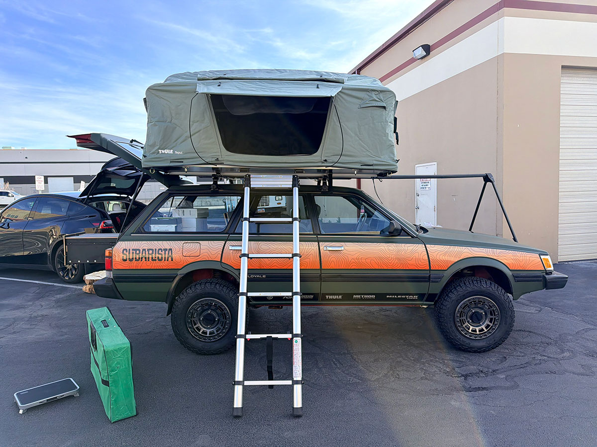 Subarista vintage Subaru wagon build with rooftop tent and topographic wrap