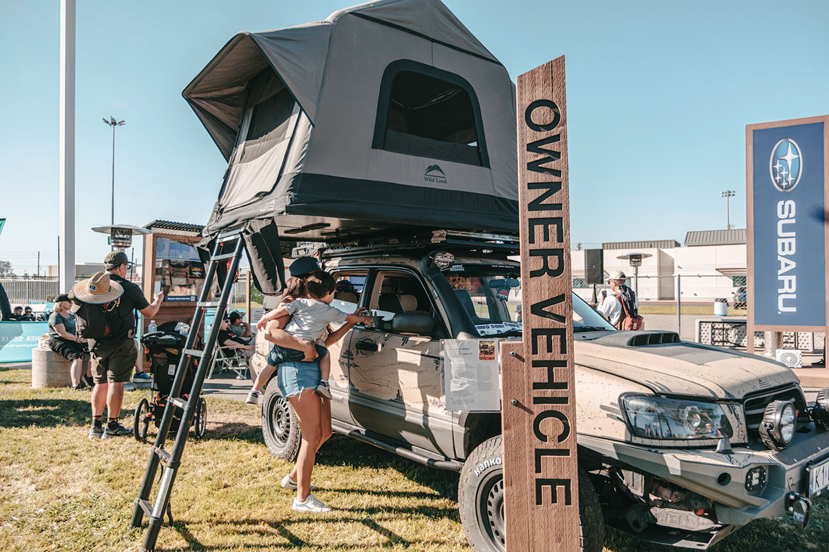 Owner vehicle showcase with rooftop tent at Subaru booth