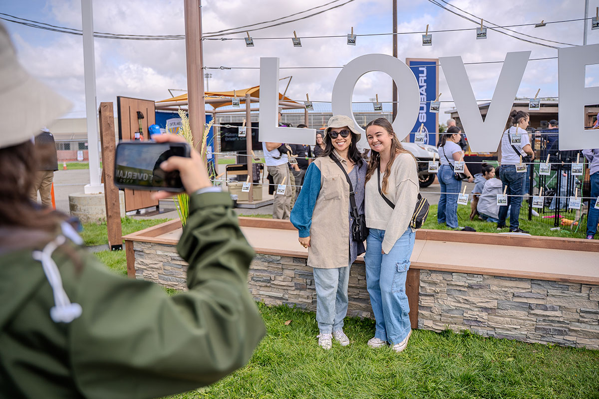Guests posing for photos at the LOVE letters installation