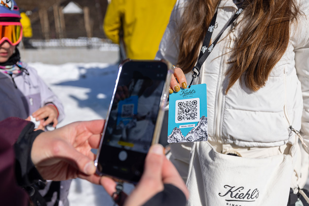 Guest scanning a Kiehl's branded QR lanyard